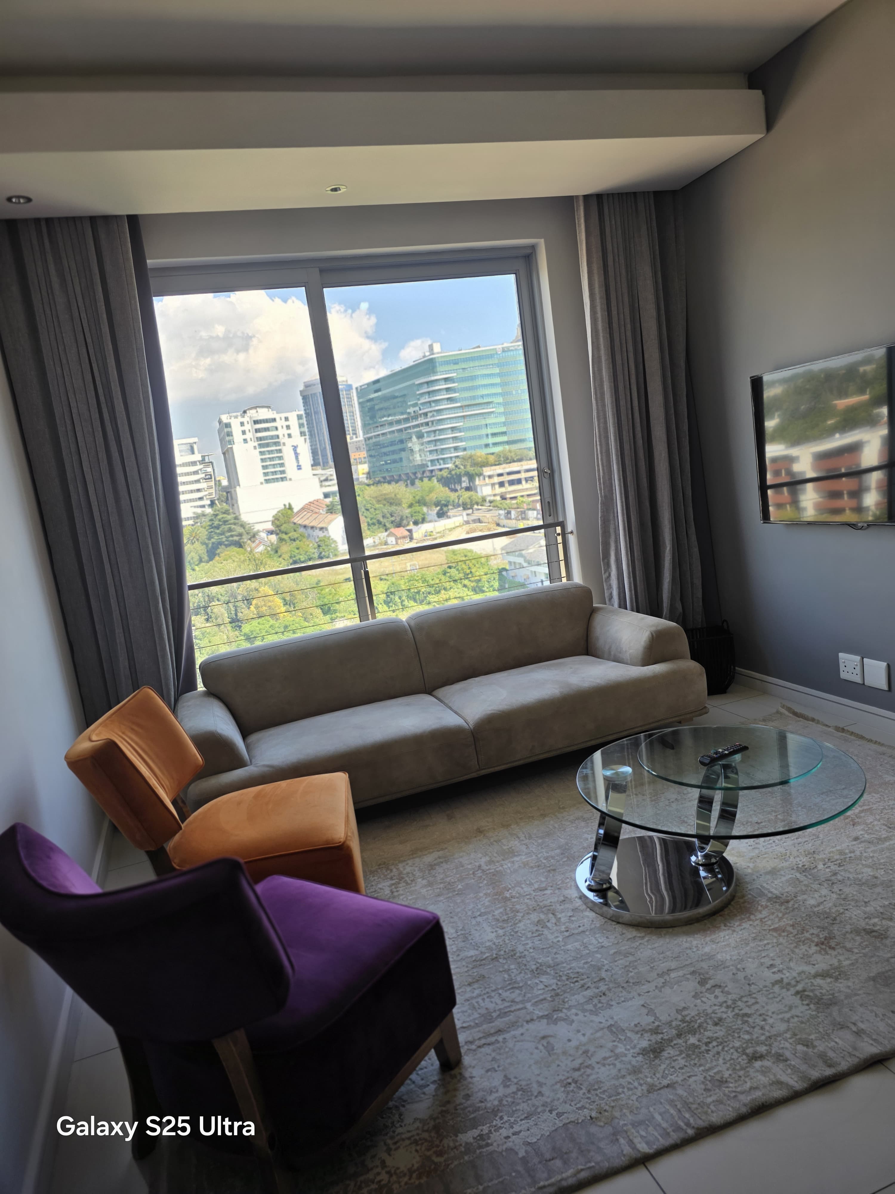 Comfortable living room with sofa and glass coffee table