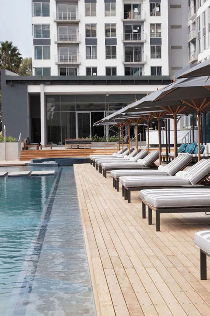 Rooftop infinity pool with sun loungers and pool deck