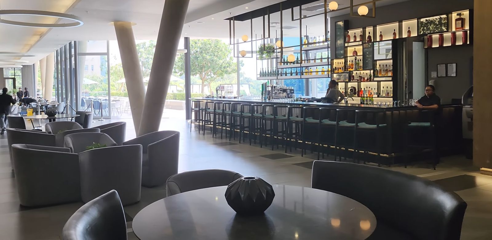 Contemporary bar and lounge area with full spirits display