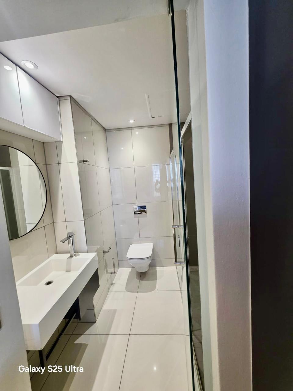 Modern en-suite bathroom with walk-in shower